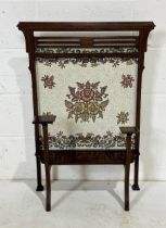 An Edwardian fire screen with inlaid detail and tapestry back