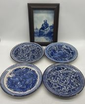 A Delft plaque (frame in need of attention) along with four blue and white chargers (some chips to