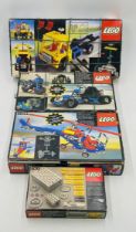 Four boxed vintage Lego Technic sets including Tow Truck (8846), Helicopter (8844), Go Kart (854)