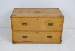 An antique pine campaign chest of two drawers, with brass campaign handles and wrought iron