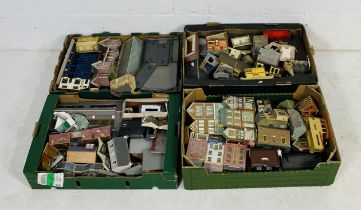 A collection of model railway OO gauge buildings including stations, goods sheds, shops, signal