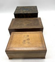 A wooden box with German inscription on the inside "Happy Christmas 1950", along with two