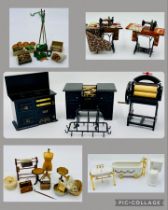 A collection of dolls house furniture and accessories including a ceramic bathroom suite, kitchen