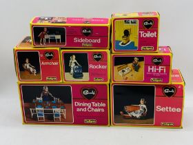 A collection of seven vintage boxed Pedigree Sindy accessories including a Settee, Dining Table &