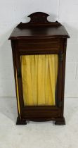 An Edwardian musical cabinet with velvet inner shelves