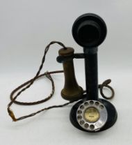 A vintage stick telephone marked No. 150 to the side and TE 234 No. 22 to the earpiece