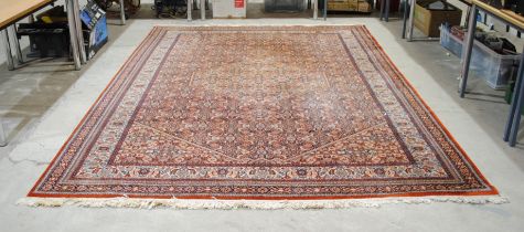 A large 'Saint-Maclou' Eastern style red ground rug - 240cm x 340cm