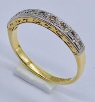 An 18ct gold half eternity ring set with diamonds, size N 1/2