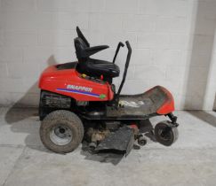 A Snapper ride-on petrol lawn mower - one wheel stuck in gear