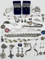 A collection of 925 and hallmarked silver jewellery, earrings, necklaces, pendants etc.