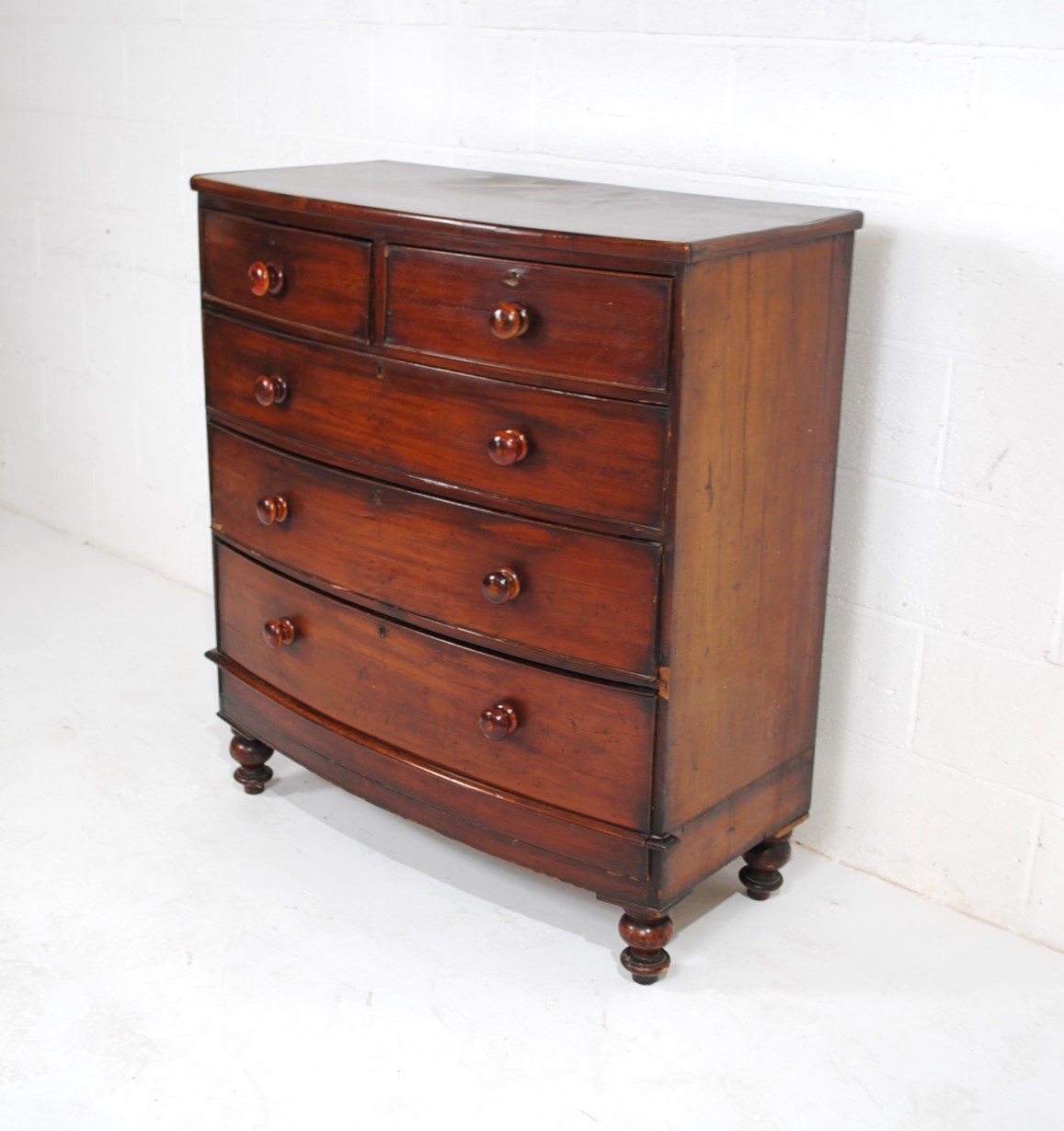 A Victorian mahogany bow-fronted chest of five drawers, raised on turned legs - one leg loose but - Image 2 of 8