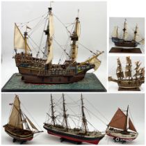 A collection of five model ships and boats
