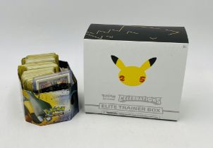 A collection of various Pokemon cards, mostly earlier sets including a holographic Blastoise card.