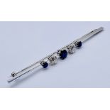 An Art Deco 18ct white gold bar brooch set with diamonds and sapphires- diamonds measure approx. 5mm