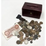 A collection of various coinage in vintage leather case