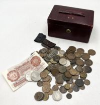 A collection of various coinage in vintage leather case