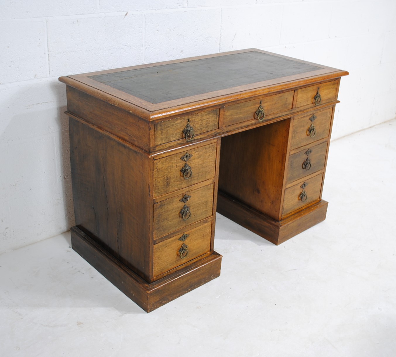 A Victorian oak kneehole writing desk, with green leather inset top and nine drawers - length 106cm, - Image 3 of 9