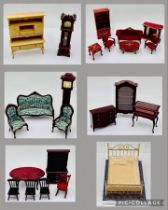 A collection of dolls house furniture (mainly mahogany style) including grandfather clock, dining