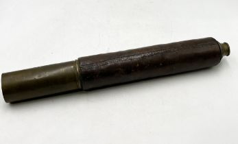 A leather bound brass single draw night-and-day telescope, marked for J.J. Cutts, London