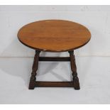 A small circular oak coffee table - diameter 55cm, height 40cm