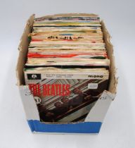 A quantity of various 7" vinyl records, including The Beatles, The Fortunes, The Sweet, Slade, The