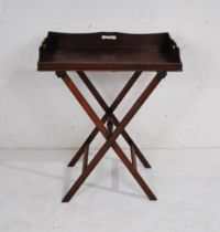 A Georgian mahogany butlers' tray on stand