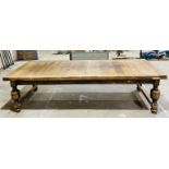 A large oak drawer leaf table on baluster legs - length 305cm, height 79cm, depth 137cm - approx.