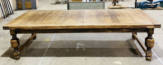 A large oak drawer leaf table on baluster legs - length 305cm, height 79cm, depth 137cm - approx.
