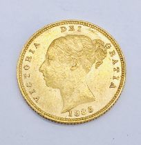 A Victorian half sovereign with shield back, dated 1885