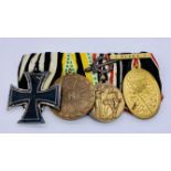A group of four German WWI medals including an Iron Cross 2nd class