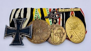 A group of four German WWI medals including an Iron Cross 2nd class