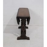 A small antique oak dropleaf table - height 48.5cm