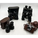 A collection of binoculars including a pair of West German Optolyth Alpin 10 x40 binoculars