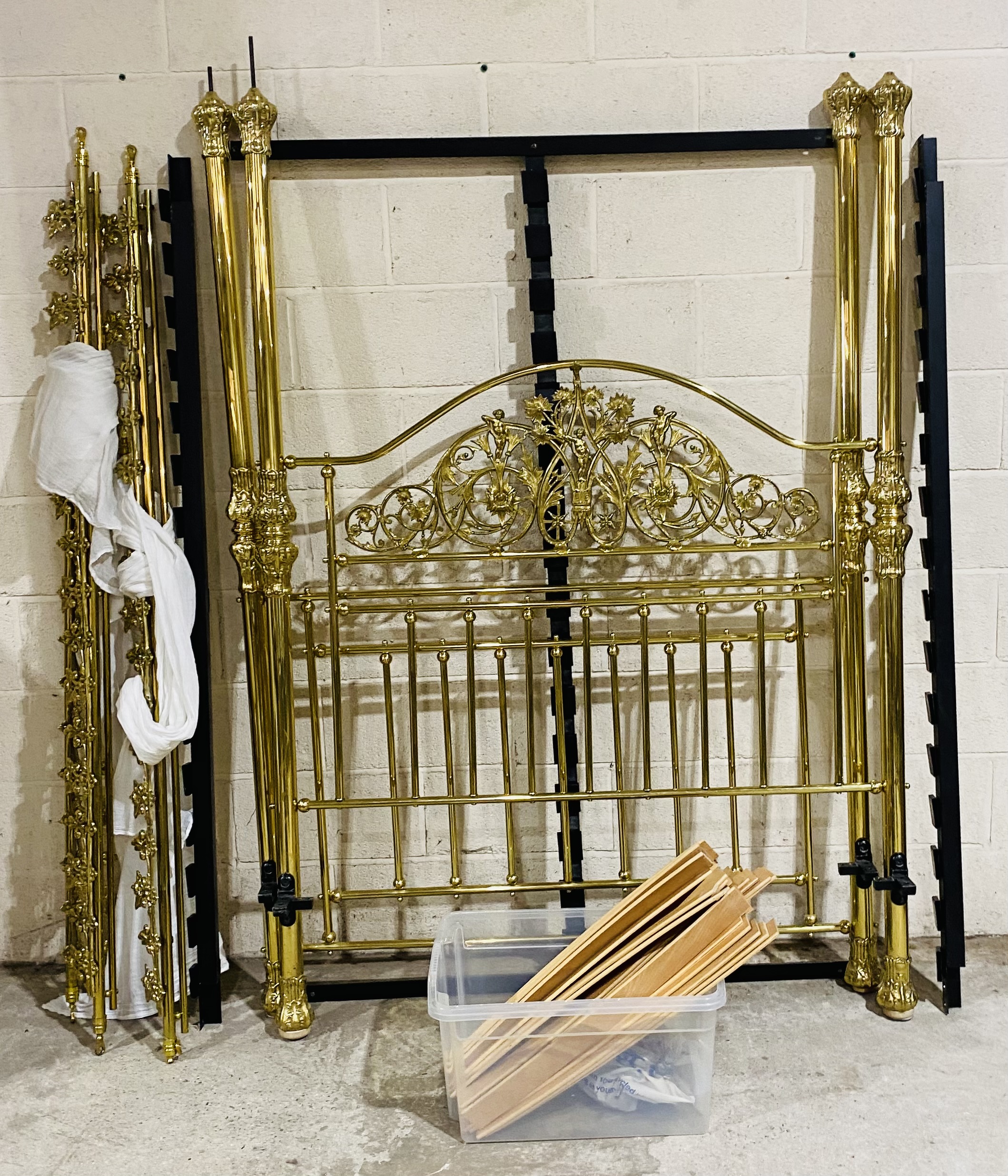 An ornate brass four poster bed