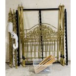 An ornate brass four poster bed