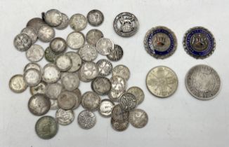 A small collection of silver coinage along with two hallmarked silver medallions for Exeter &