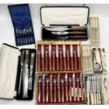 A collection of silver plated cutlery, boxed carving sets etc.