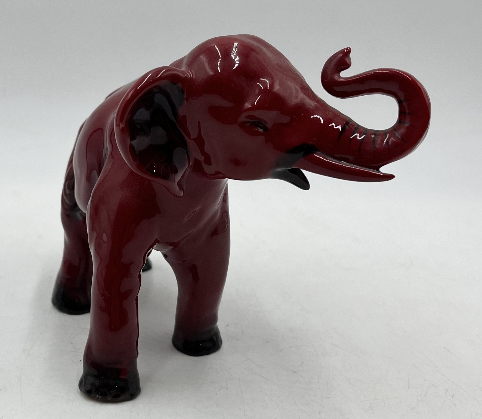 A Royal Doulton Flambe elephant with raised trunk signed by Michael Doulton in gold to the base - Image 2 of 4