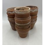 A collection of sixteen vintage terracotta pots