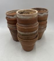 A collection of sixteen vintage terracotta pots