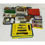 A large collection of model railway OO gauge accessories including buildings, rolling stock, Tri-ang