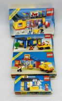 Four boxed 1980's Lego Legoland sets including Motorcycle Shop (6373), Auto Repair Shop (6363), Post