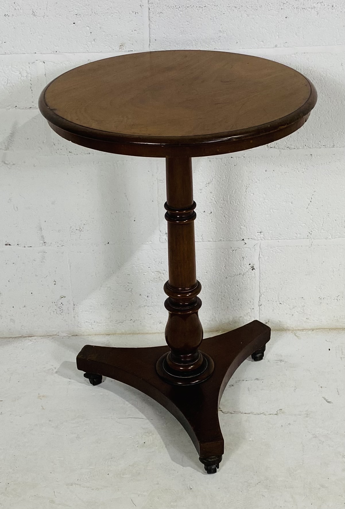 A Victorian occasional table on tripod base