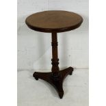 A Victorian occasional table on tripod base