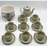 A Denby part tea set with teapot and eight cups and saucers along with a Portmeirion planter