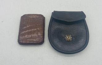 A day sporran along with a crocodile skin cigar case. The sporran is stamped Wm Anderson & Sons,