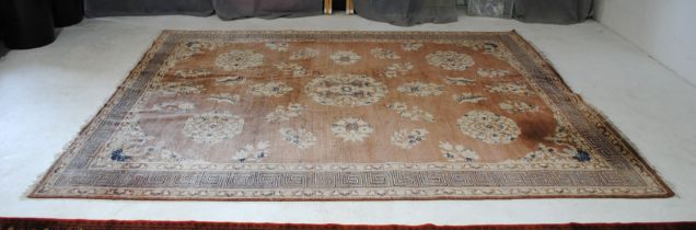 A large red ground rug, with Greek key pattern design to border - 245cm x 300cm