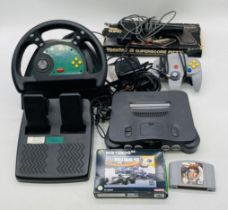 An unboxed vintage Nintendo 64 games console (with power unit) with accessories including one