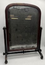 A Victorian toilet mirror with distressed glass