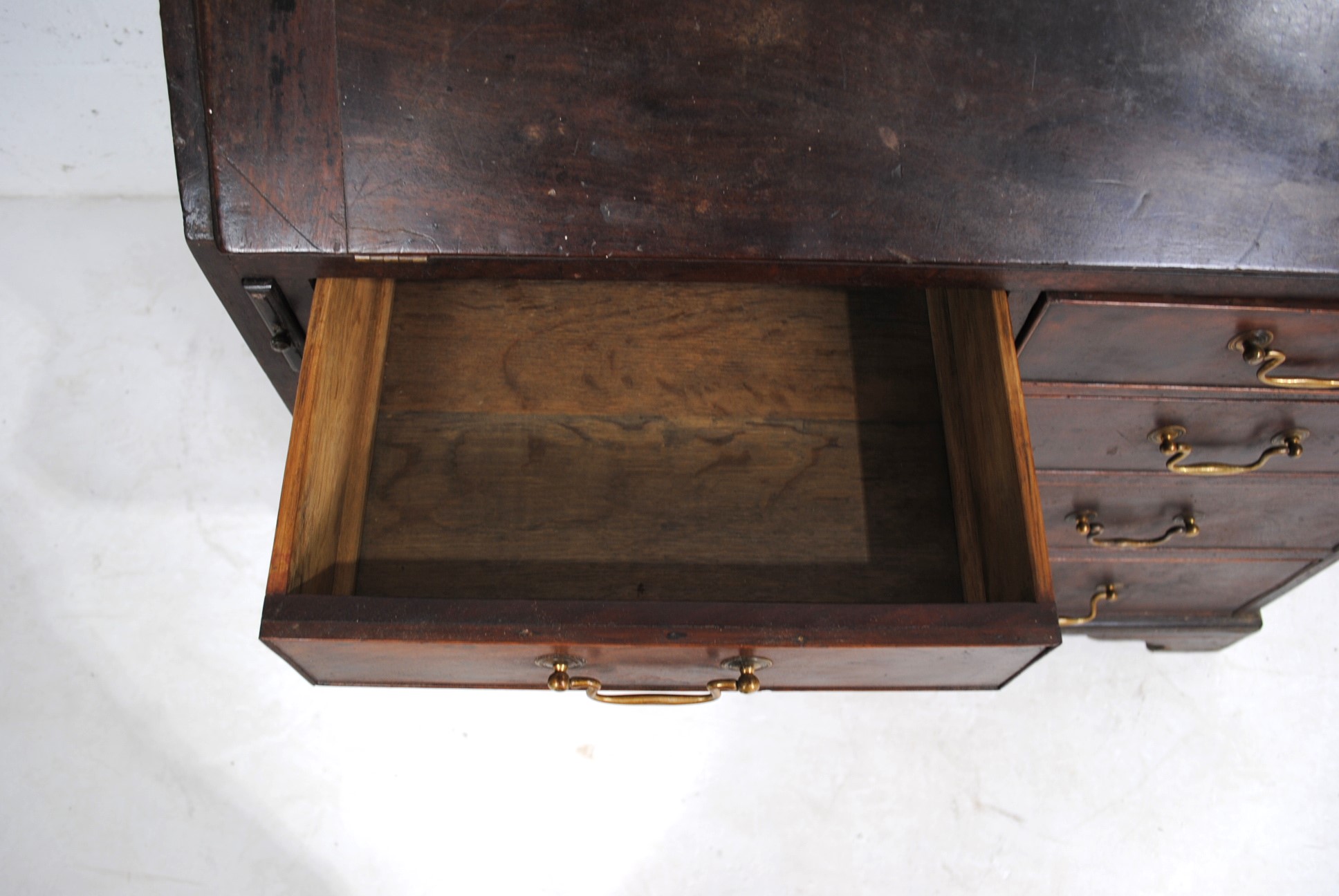 A Georgian mahogany bureau, with five drawers with brass handles, raised on bracket feet, with - Image 7 of 9